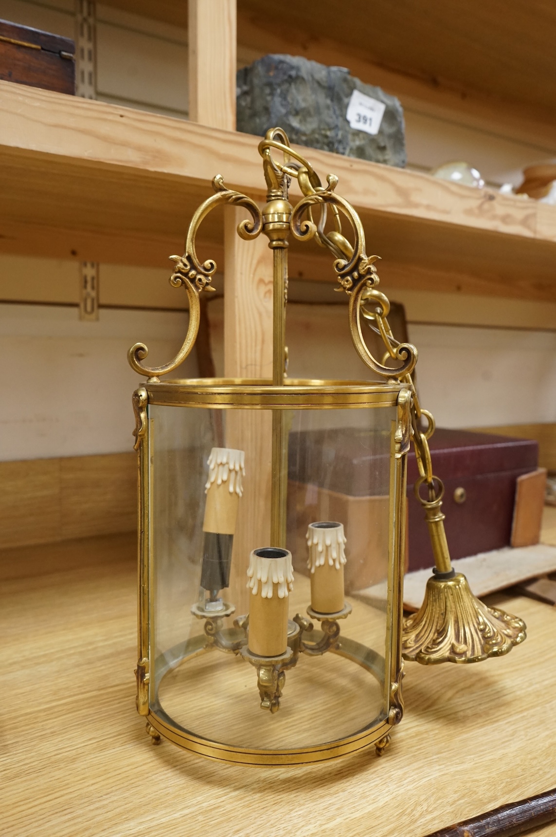A cylindrical brass hanging hall lantern, 86cm high overall